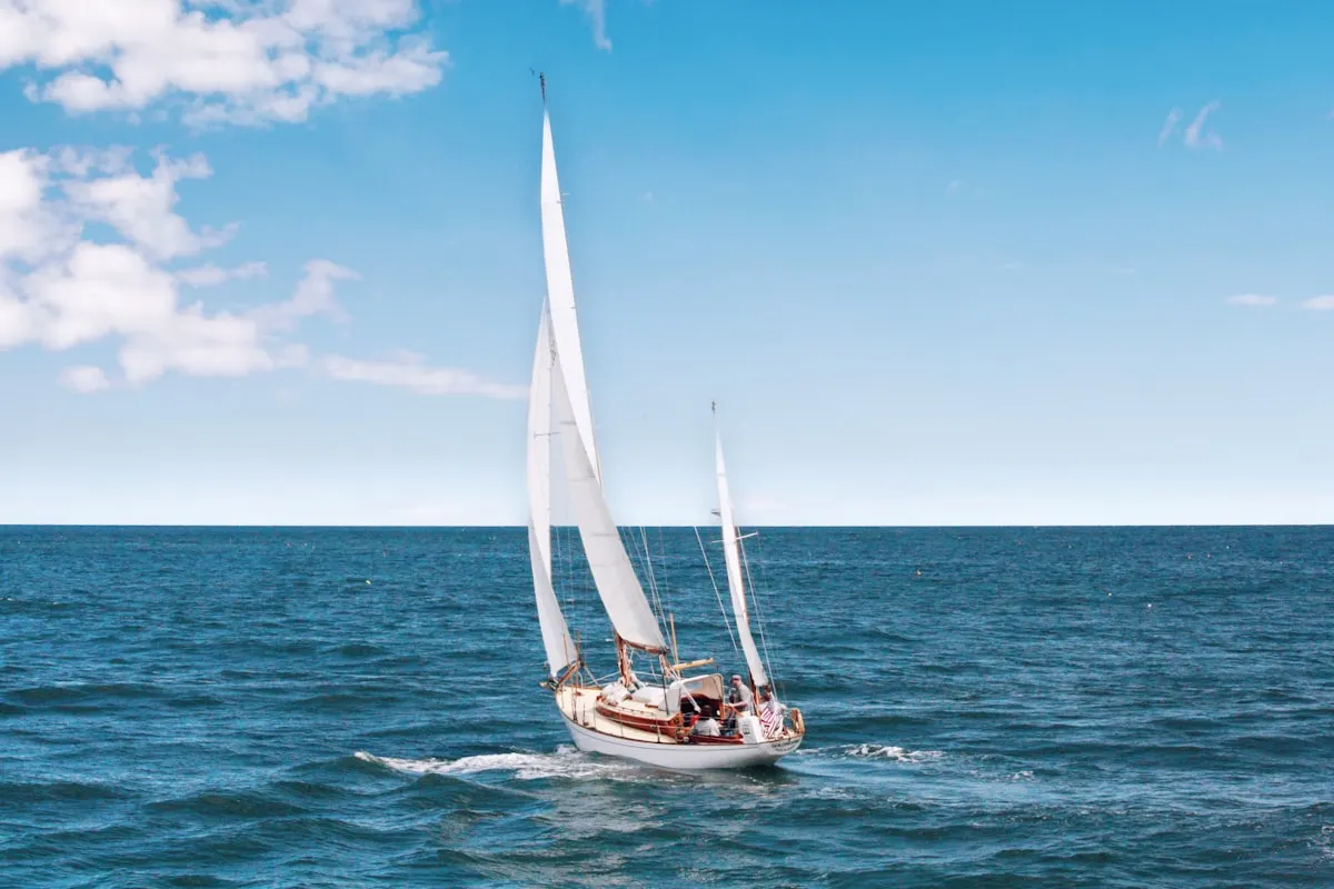 Sailing vessel crossing open blue water